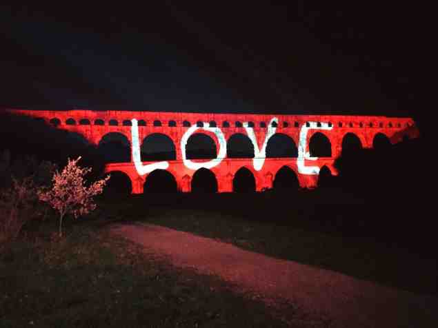 Love lighting display on the Pont du Gard