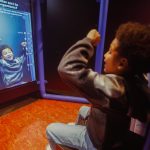child plays at Uniquely Us