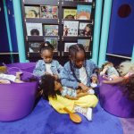 children sitting and playing at Uniquely Us